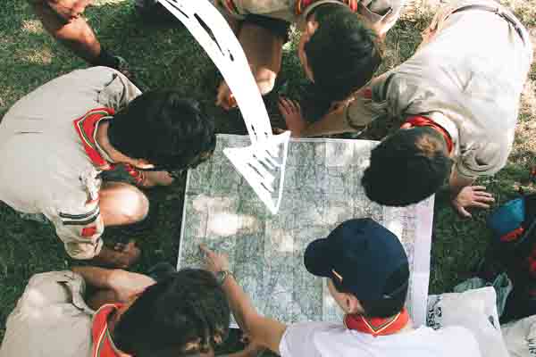 scouts looking at map