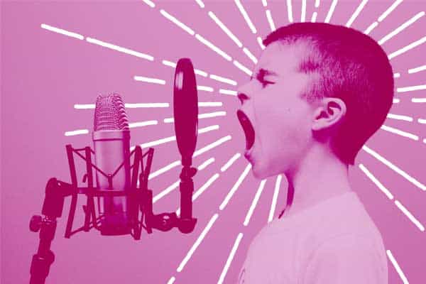child announcing yearbook on microphone