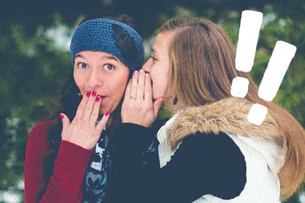 girls whispering secret confessions